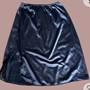 Mid-length black silky skirt with lace detail